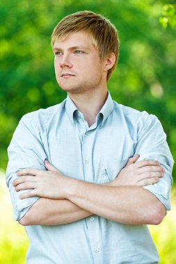 Portrait of man with his arms folded clipart