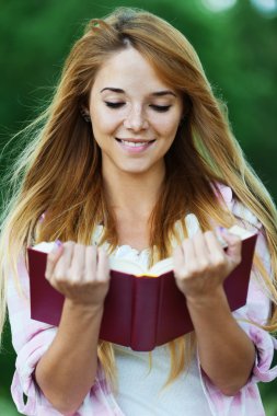 Woman reading book clipart