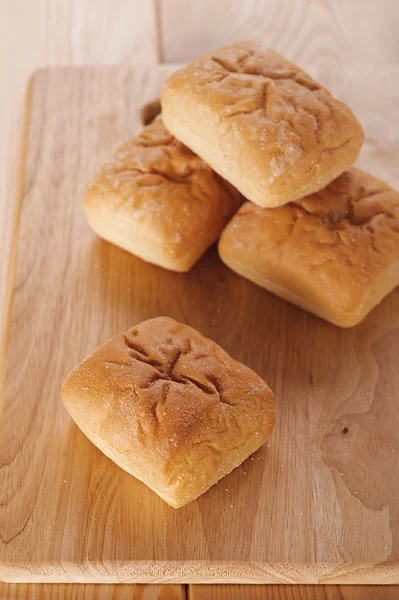 stock image Rolls on wooden background