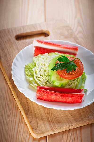 Crab sticks, cabbage, tomato, cucumber — Stock Photo, Image