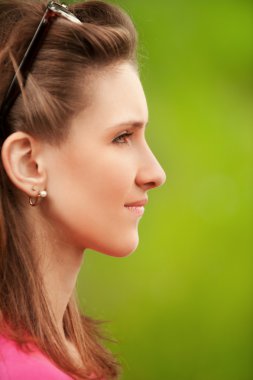 Profile portrait of beautiful young woman clipart