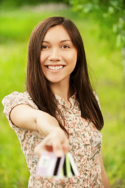 Young woman holding several credit cards — Stock Photo, Image