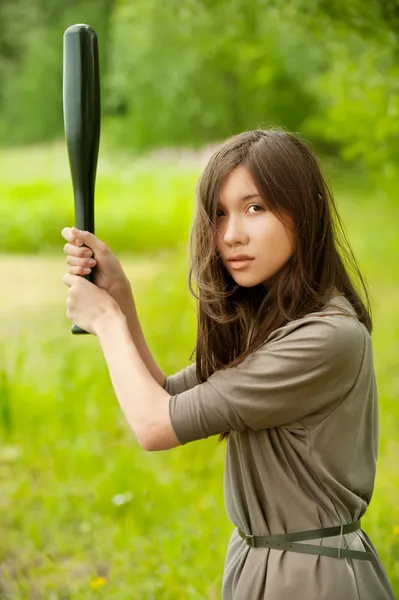 Young asian woman with bat — Stock Photo, Image
