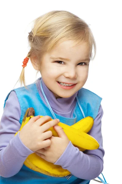 Kleines lächelndes Mädchen mit Bananen — Stockfoto