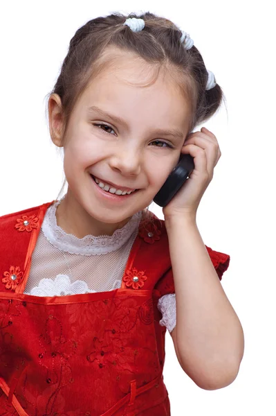 Pequena menina sorridente com telefone — Fotografia de Stock