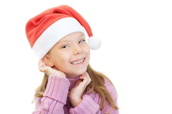 Little girl in Christmas hat smiles — Stock Photo, Image