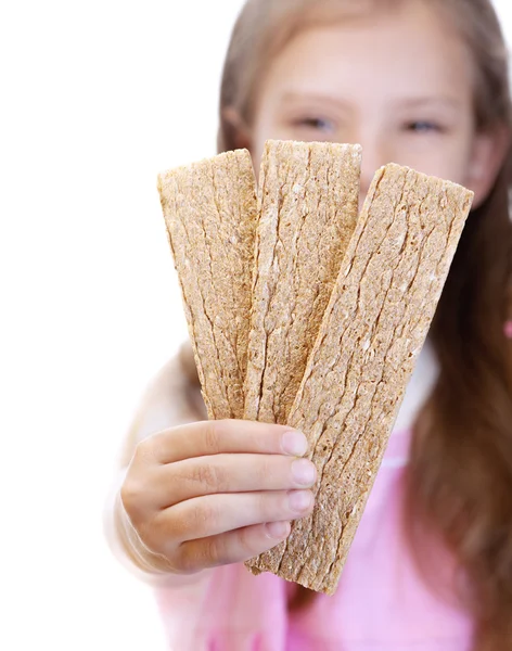 Little girl holding dry bread — Stock Photo, Image