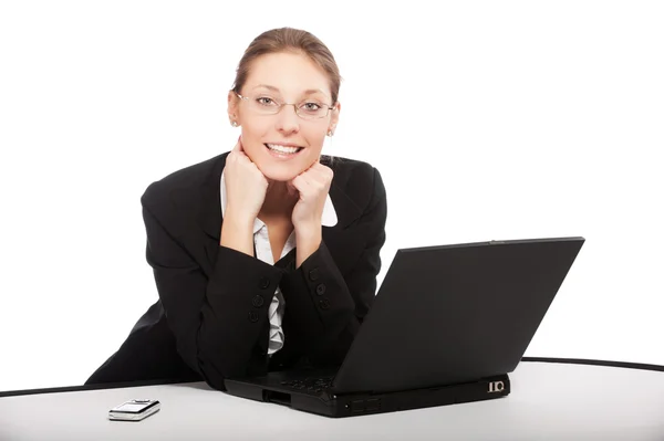 Schöne junge Geschäftsfrau arbeitet am Laptop isoliert auf whit Stockbild