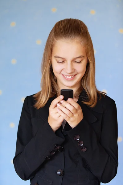 Beautiful blue-eyed girl-teenager reading sms — Stock Photo, Image