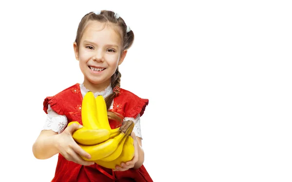 Little smiling girl with bananas — Stock Photo, Image