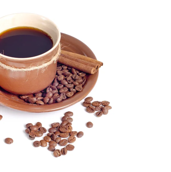 Koffie beker en bonen achtergrond — Stockfoto
