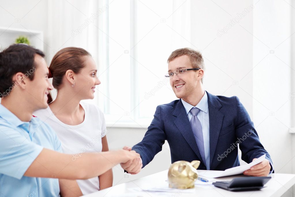 The consultant shakes hands with a man