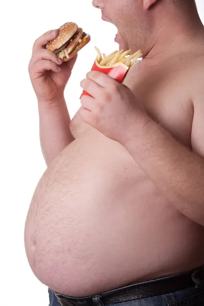 Gordo com sanduíche e batatas fritas — Fotografia de Stock