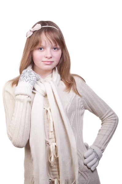 Portrait of a young girl in white sweater, scarf and mittens — Stock Photo, Image