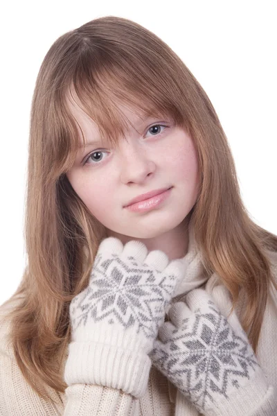 Portrait of a young girl in white sweater and mittens — Stock Photo, Image