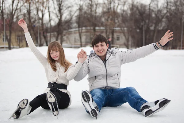 Couple having fun on ice skate rink outdoors. — Stock Photo, Image