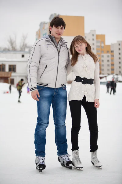 Couple on ice skate rink outdoors. — Stock Photo, Image