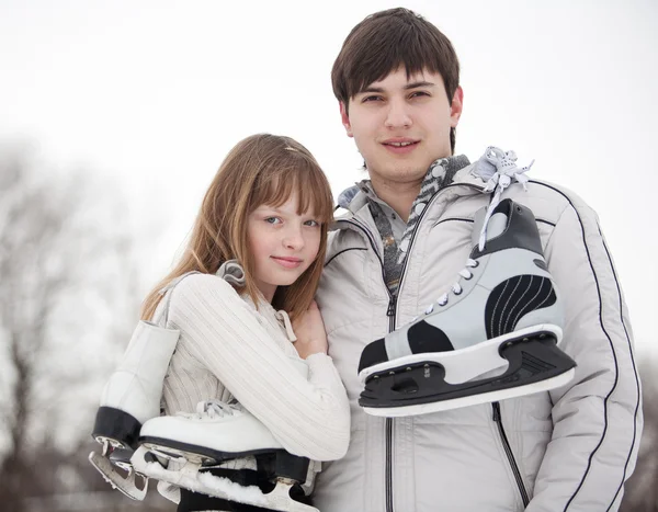 Couple with skates — Stock Photo, Image