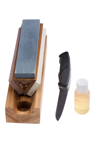 Sharpener stone and knife close up — Stock Photo, Image