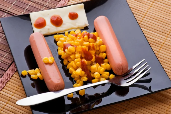 Sausage with corn — Stock Photo, Image