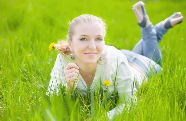 Girl on dandelion — Stock Photo, Image