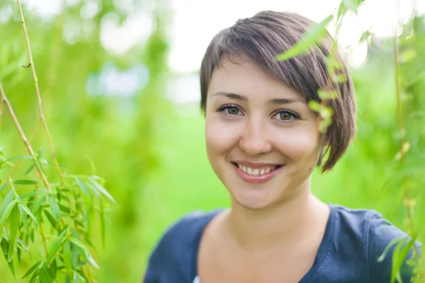 Stock image Girl in a summer forest