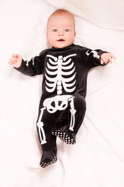 Cute baby portrait in funny skeleton suit isolated on white back — Stock Photo, Image