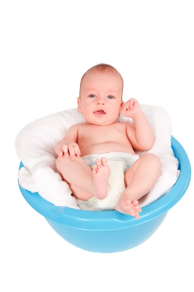 Cute baby portrait in washbasin isolated on white background — Stock Photo, Image