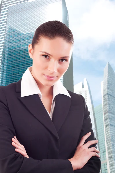 Young business woman over business center background — Stock Photo, Image