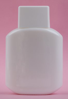 Perfumery bottle on pink background