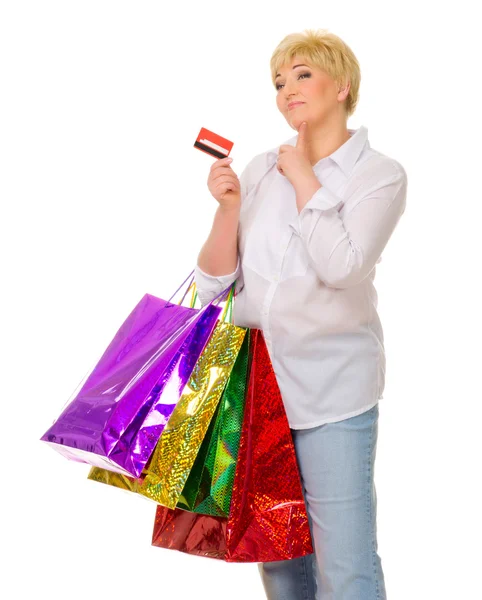 Senior mulher com cartão de crédito e sacos — Fotografia de Stock