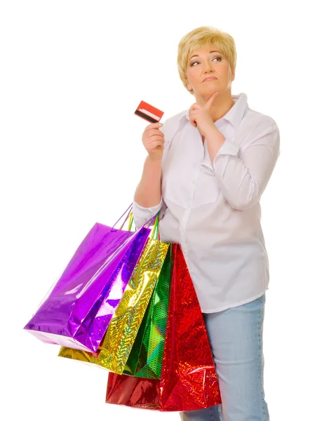 Senior vrouw met tassen en credit card — Stockfoto