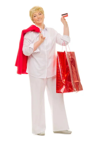 Mujer mayor con bolsos y tarjeta de crédito —  Fotos de Stock