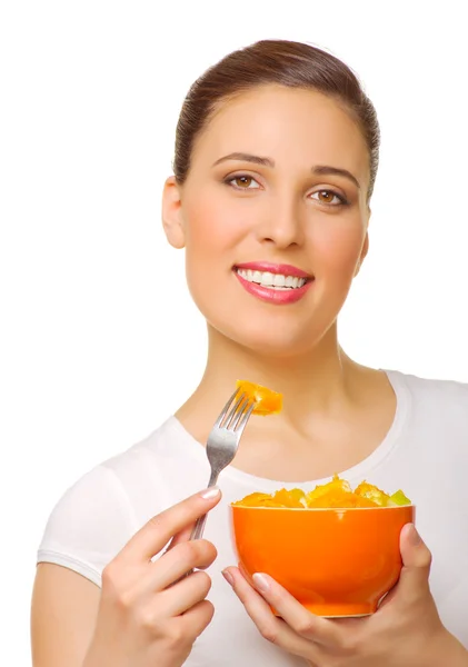 フルーツ サラダを持つ若い女 ストック画像