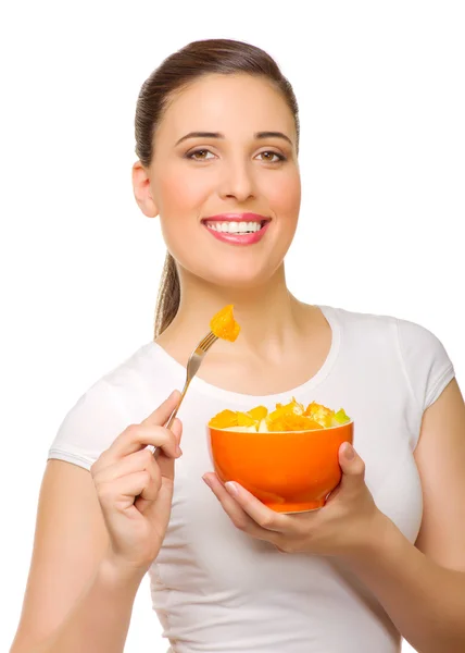 フルーツ サラダを持つ若い女 ロイヤリティフリーのストック画像