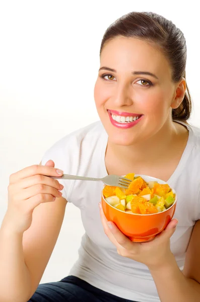 Young woman with fruit salad Stock Photo