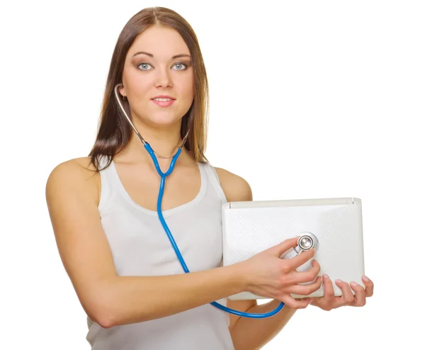 Young smiling girl with laptop and stethoscope — Stock Photo, Image
