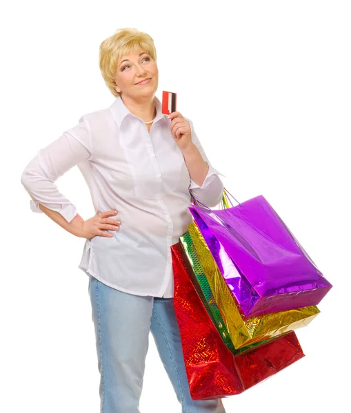 Mujer mayor con bolsos y tarjeta de crédito — Foto de Stock