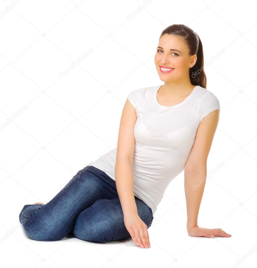 Young woman sitting on the floor