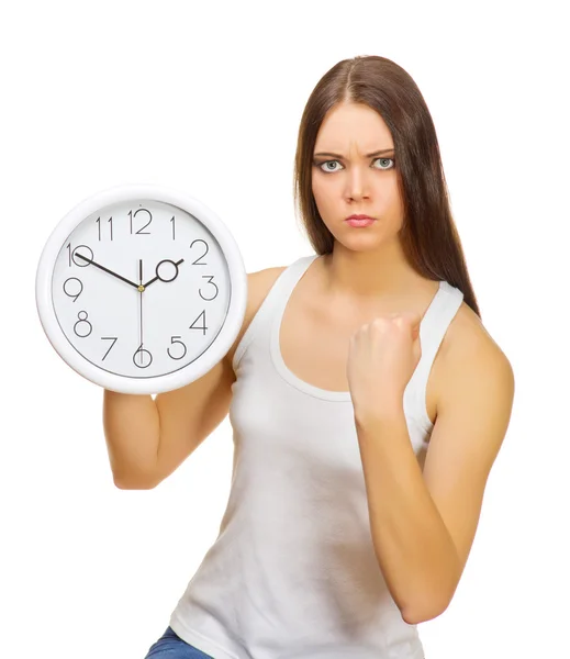 Young angry girl with clocks — Stock Photo, Image