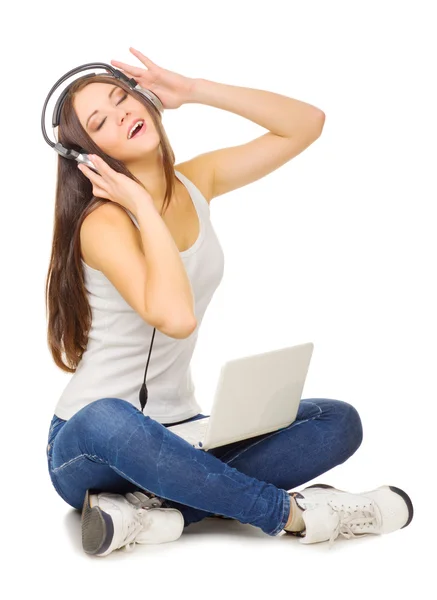 Young girl listen music by headphones — Stock Photo, Image