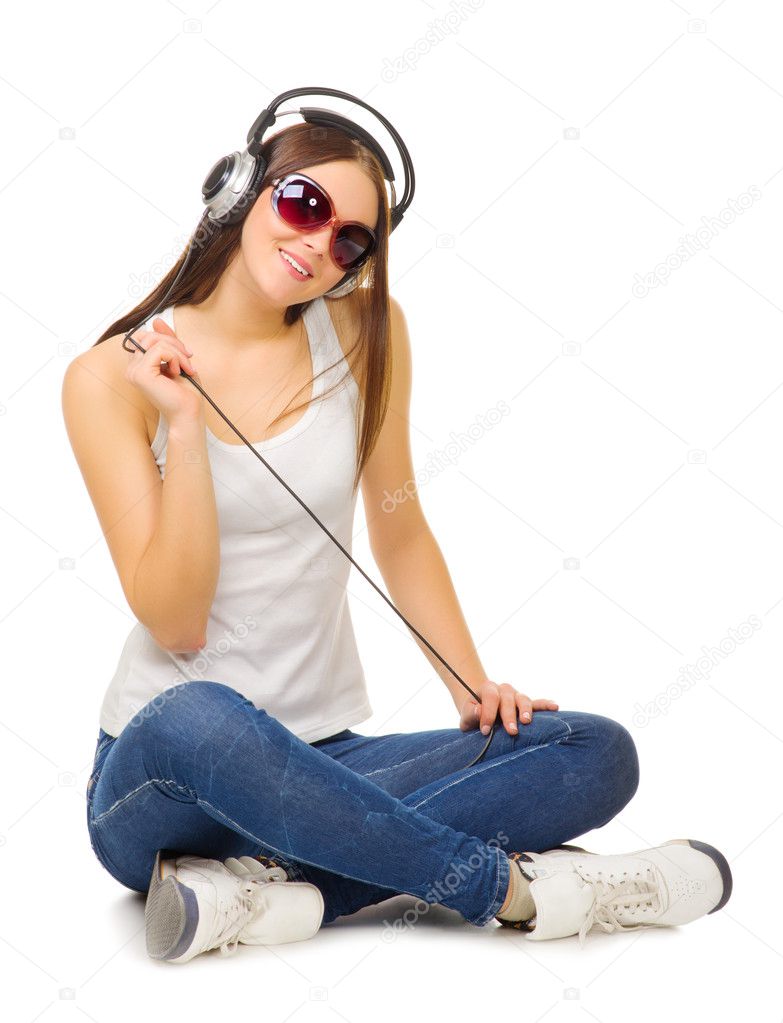 Young girl listen music by headphones