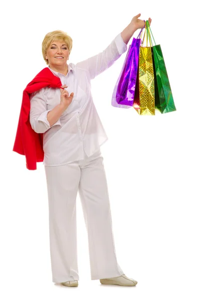 Happy standing senior woman with packets — Stock Photo, Image