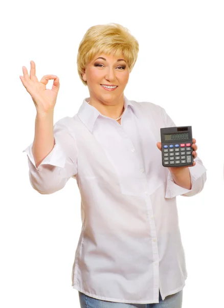 Старша жінка з калькулятором — стокове фото