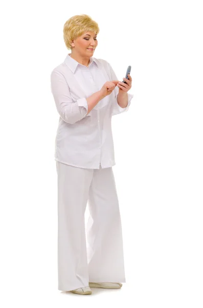 Starší žena s mobilním telefonem — Stock fotografie