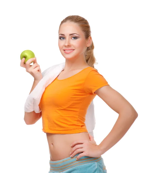 Joven mujer deportiva con manzana — Foto de Stock