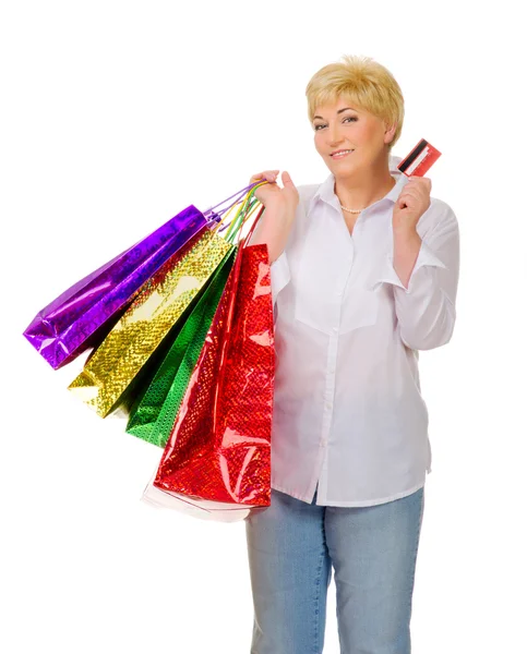 Mulher sênior com sacos e cartão de crédito — Fotografia de Stock