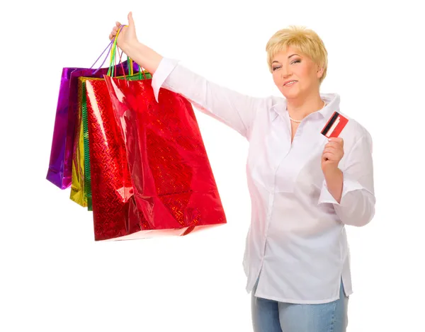 Mulher sênior feliz com sacos e cartão de crédito — Fotografia de Stock