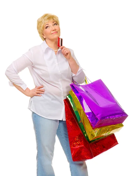 Senior vrouw met tassen en credit card — Stockfoto
