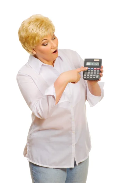 Старша жінка з калькулятором — стокове фото